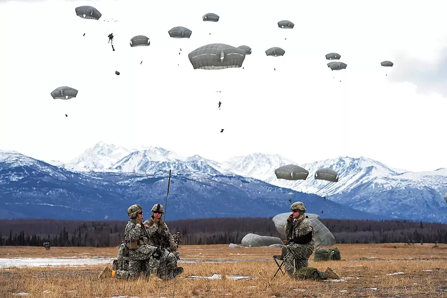 Paratroopers assigned to the 4th Infantry Brigade Combat Team practice a forced-entry parachute assault at a base in Alaska as part of a larger tactical field exercise. - U.S. AIR FORCE/ALEJANDRO PENA PHOTO