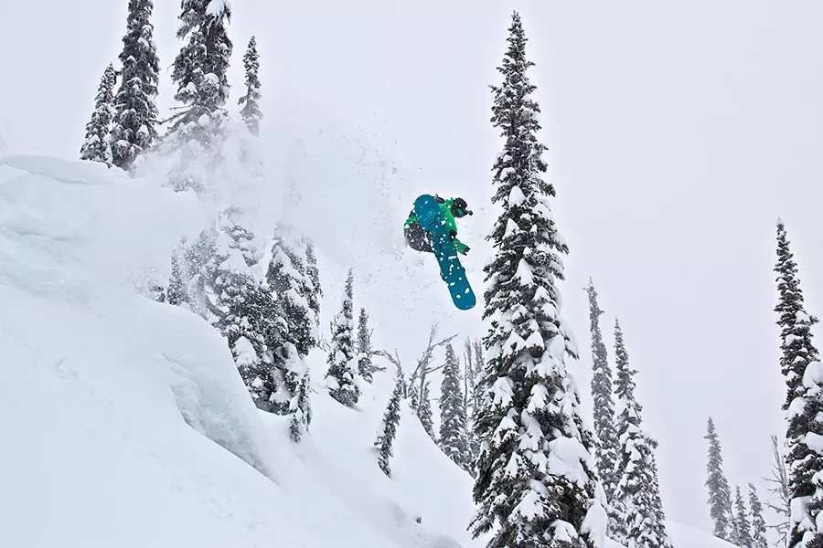 When the season is right, Jeff Yates and his snowbard are never far apart. - BOB LEGASA