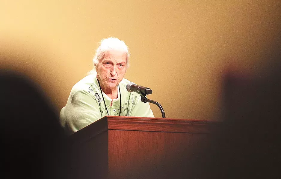 Longtime women's rights activist Sally Jackson riles up the crowd inside the Spokane Convention Center. - YOUNG KWAK