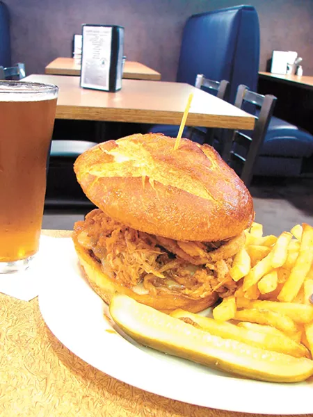 Menu classics include a pulled pork sandwich. - CARRIE SCOZZARO