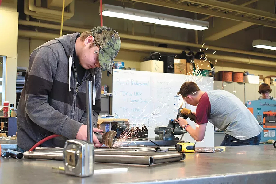 Wyatt Eitreim (left) welds in the shop at Shadle Park High School. - WILSON CRISCIONE