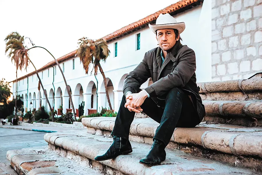 Foo Fighters' guitarist Chris Shiflett boot-scoots into The Big Dipper Friday. - BRANTLEY GUTIERREZ