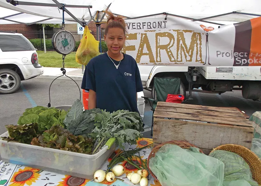 Monicea Brown sells locally grown vegetables at the the Kendall Yards Night Market.
