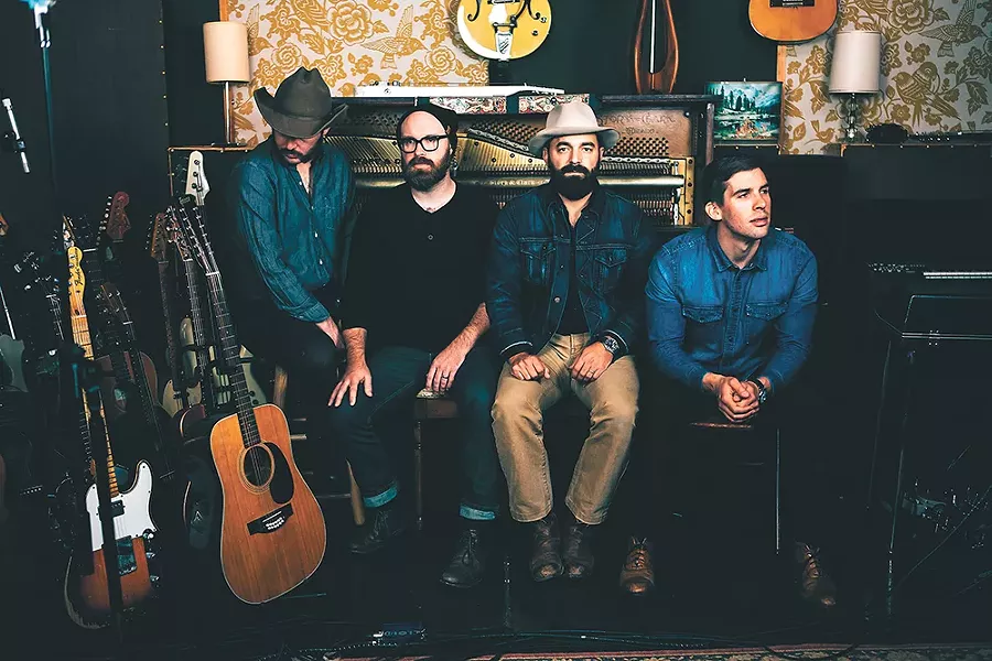 Drew Holcomb (second from right) and the Neighbors, who play Spokane for the first time on May 4.
