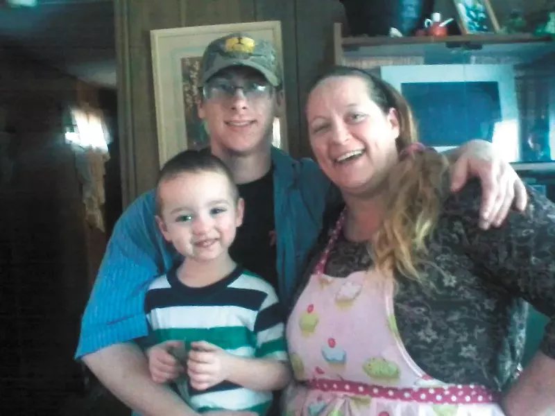 Tim Moore with his mom and little brother.