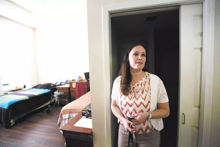 Brenda Graham, Carlyle's director, gives a tour of a resident's room. - YOUNG KWAK