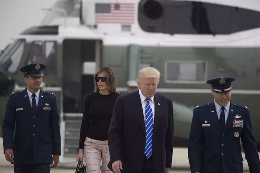 President Donald Trump and first lady Melania Trump on July 5 at Joint Base Andrews in Maryland. - STEPHEN CROWLEY/THE NEW YORK TIMES