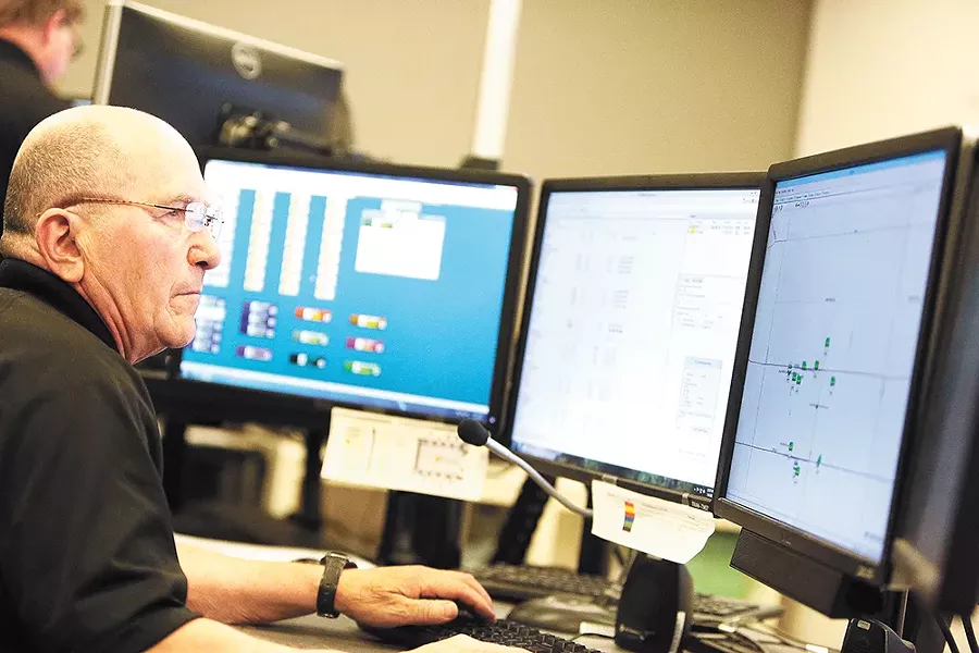 John Schlabach monitors buses around all the city from the Spokane Transit Authority communications center. - YOUNG KWAK