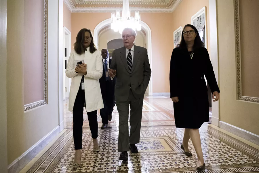 Senate Majority Leader Mitch McConnell (R-Ky.) walks with members of his staff on Capitol Hill in Washington, July 20, 2017. After seven months of deliberation, Republicans have reached the moment when they have to vote on repealing the Affordable Care Act, but they have yet to be told precisely what they will be voting on. - TOM BRENNER/THE NEW YORK TIMES
