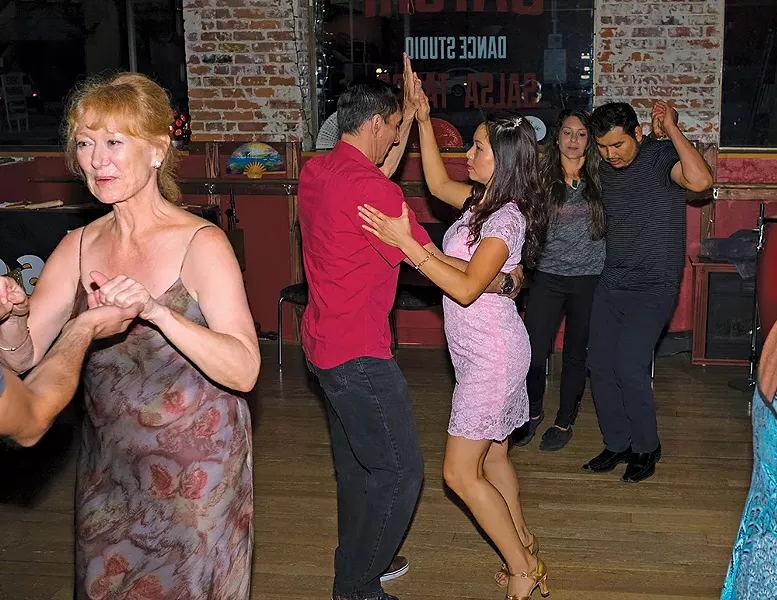 Dancers at Spokane's Satori Dance Studio move to Latin rhythms. - HECTOR AZION