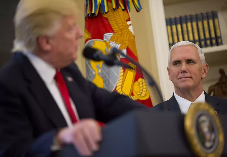 Vice President Mike Pence looks at President Donald Trump in the Oval Office of the White House in Washington, March 31, 2017. Pence appears to be cementing his status as Trump’s heir apparent, promoting himself as the conduit between Republican donors and the administration. - ERIC THAYER/THE NEW YORK TIMES