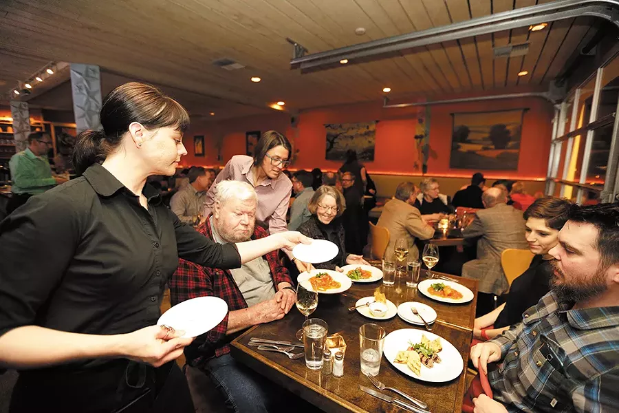 Server Christy Mills takes care of diners at Italia Trattoria. - YOUNG KWAK