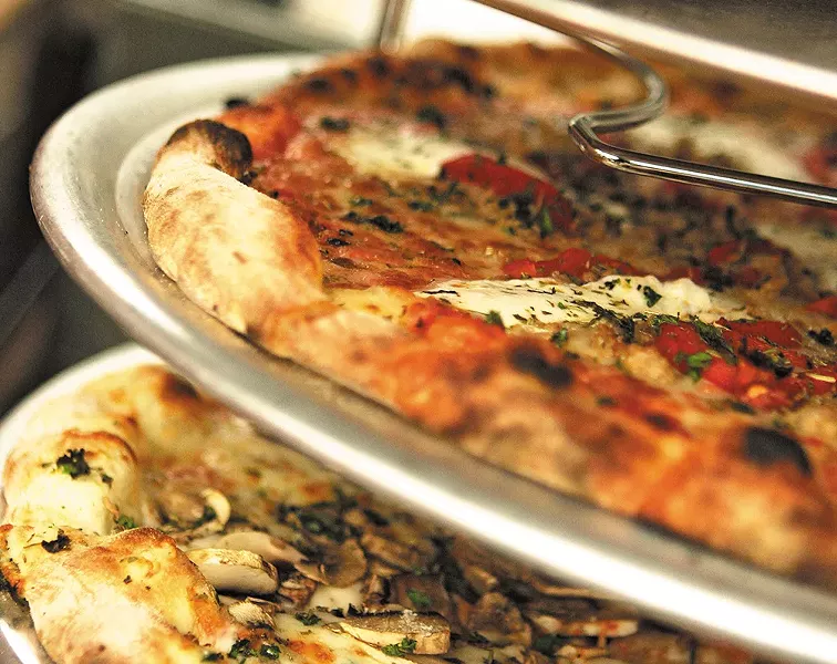 Veraci pizzas ready to be served by the slice. - YOUNG KWAK
