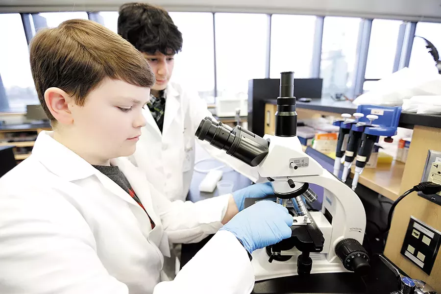 Jacob Gannon (left) and Sujal Rijal at work during a microbiology class at North Central High School. - YOUNG KWAK