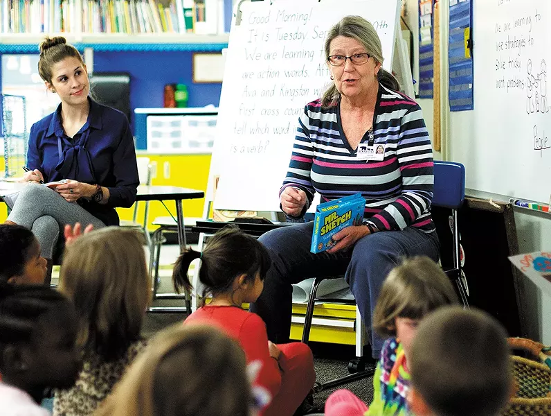 First-grade teacher Char Russell speaks with students at Roosevelt Elementary School. - YOUNG KWAK