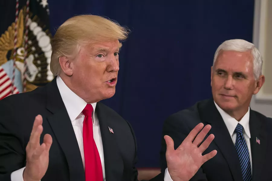 President Donald Trump speaks to reporters, as Vice President Mike Pence looks on. - AL DRAGO/THE NEW YORK TIMES