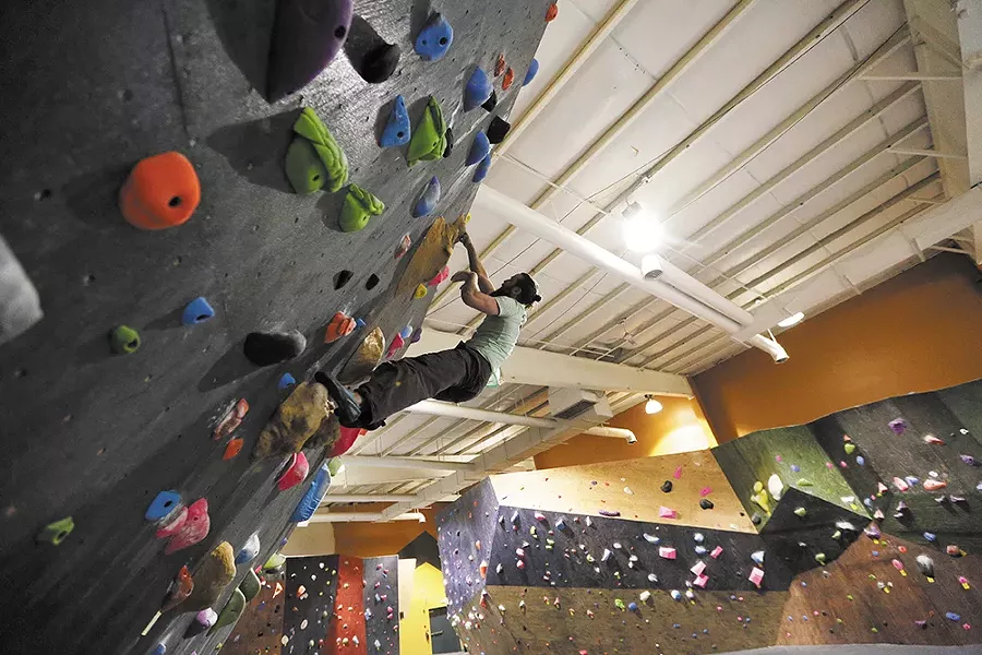 Co-owner Adam Healy climbs at Bloc Yard Bouldering Gym. - YOUNG KWAK