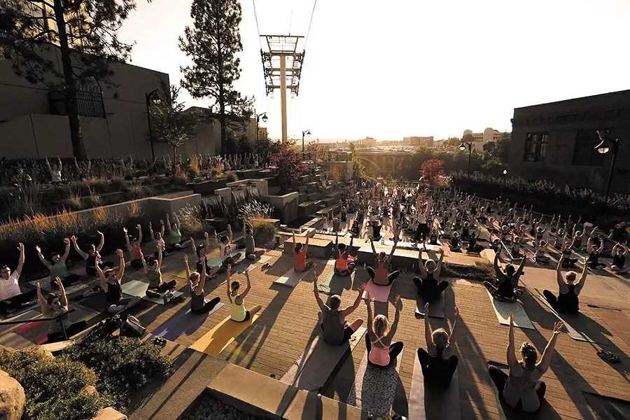Emily Stone leads hundreds of students during The Union's summer yoga series. - YOUNG KWAK