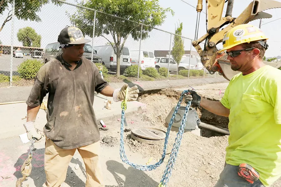 Todd Wright (right) helped Jason Jones learn construction skills during their trade classes. - YOUNG KWAK