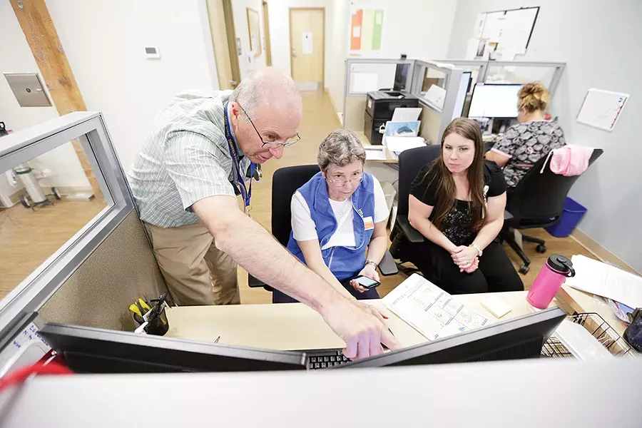 Dr. Frank Otto with Hope Burns (right) and Sue Frankovich at the House of Charity Clinic. - YOUNG KWAK