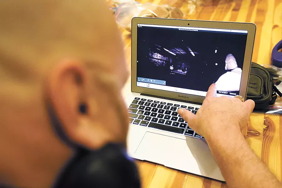 Mark Porter goes over footage captured by the Spokane Paranormal Society. - YOUNG KWAK