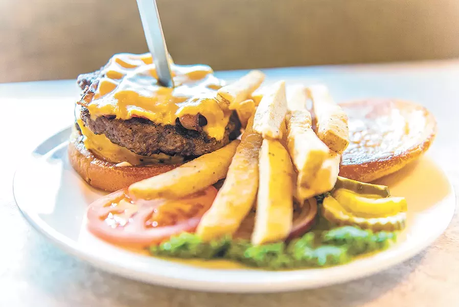 The "Unbeatable Eagle" is one of the grill's 11 hand-pressed burgers. - ERICK DOXEY