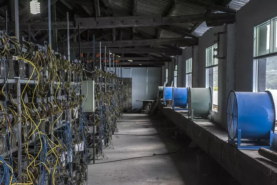 Racks of Bitcoin mining machines at a server farm in Guizhou, China, June 23, 2016 - GILLES SABRIE/THE NEW YORK TIMES