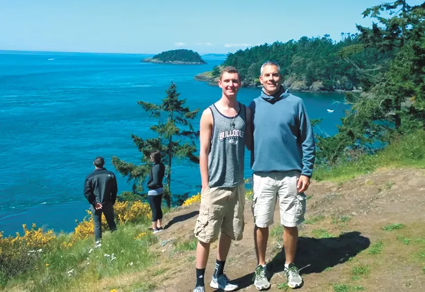 Philip Martin and his son, Chris, in an undated family photo. - COURTESY OF PHILLIP MARTIN
