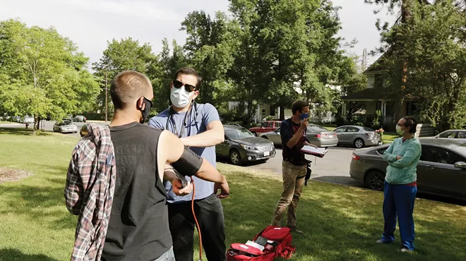Dr. Luis Manriquez takes blood pressure in Coeur d'Alene Park as part of a new Spokane collaboration working to offer health care to people experiencing homelessness.
&nbsp;