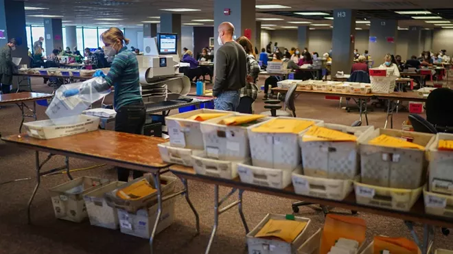 Election workers process mail-in and absentee ballots at the Central Count Facility in Milwaukee, on Election Day, Tuesday, Nov. 3, 2020.
