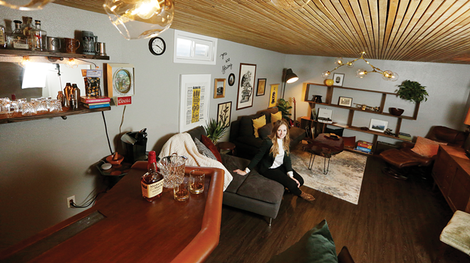 A wood-planked ceiling adds to the cozy ambiance of designer Katie Getman's basement lounge.