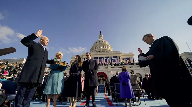 President Joe Biden, left, is sworn in by Supreme Court Chief Justice John Roberts, right, at the U.S. Capitol on Wednesday, Jan. 20, 2021. Looking on are Biden's wife Jill Biden, second from left, daughter Ashley Biden, third from left; son Hunter Biden, center; and Vice Kamala Harris, second from right.