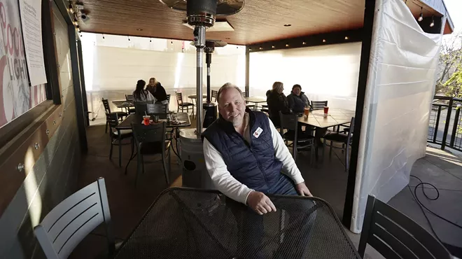 Rock City Grill owner Jim Rhoades is pictured on the South Hill restaurant's patio.