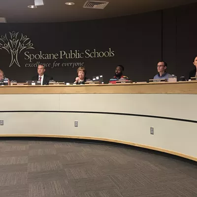 The Spokane Public Schools Board of Directors and superintendent Shelley Redinger (right).