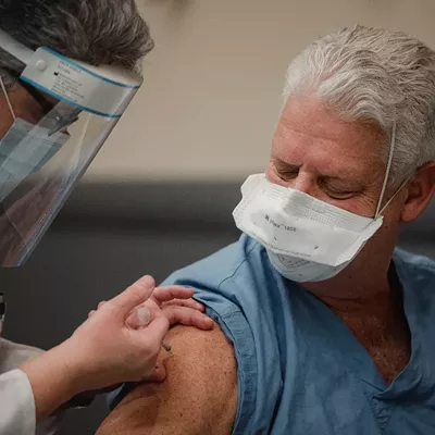 Front-Line Workers and People Over 74 Should Get Shots Next, CDC Panel Says