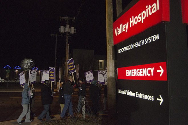 Union workers and supporters march outside Valley Hospital shortly after 6 am Wednesday during 24-hour strike. - JACOB JONES