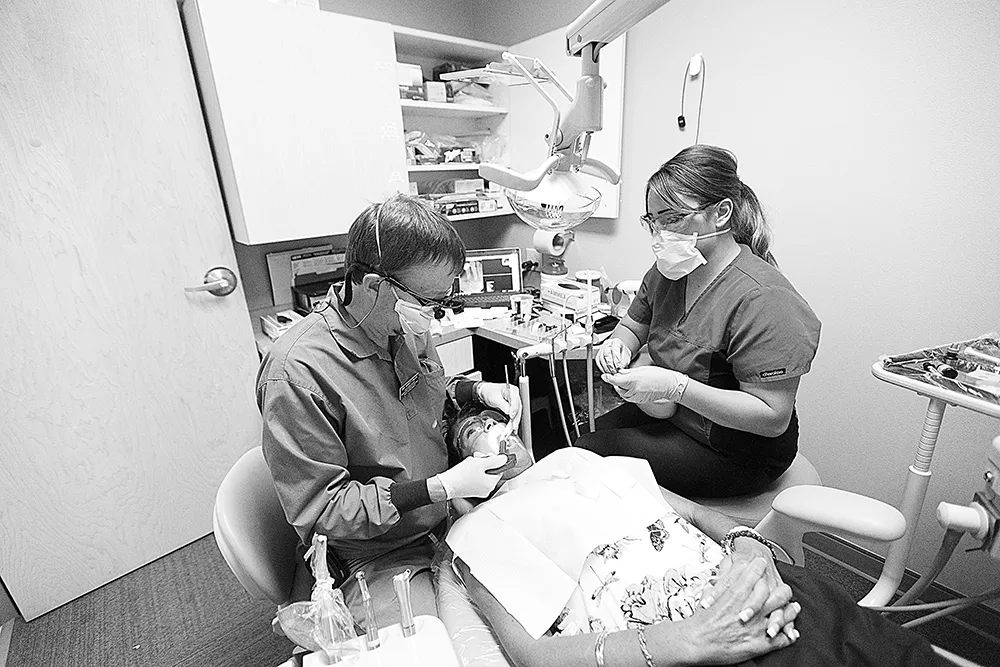 Volunteer dentist Marty Hahn, left, and volunteer dental assistant Jessika Stermer, at the Union Gospel Mission Center for Women and Children in Coeur d'Alene.|Young Kwak photo