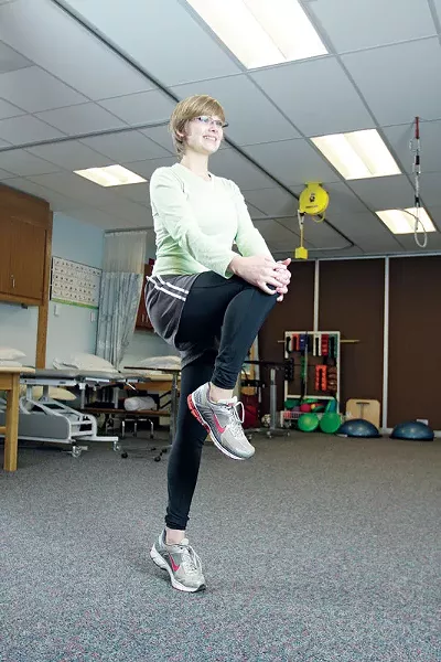WALKING KNEE TO CHEST: While walking forward, bring your knee toward your chest and lightly grab it with your hands while rising up onto your tows, repeat other side. - YOUNG KWAK