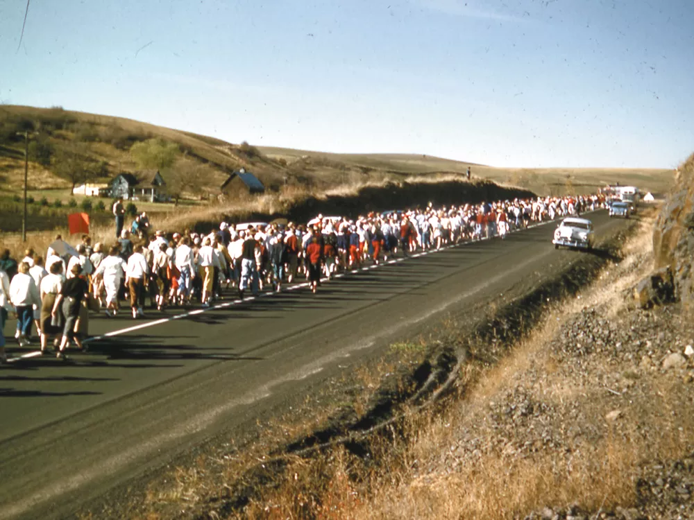 Washington State students make the "Loser\'s Walk" to the University of Idaho after an upset loss in 1954. - WSU LIBRARIES\' MASC