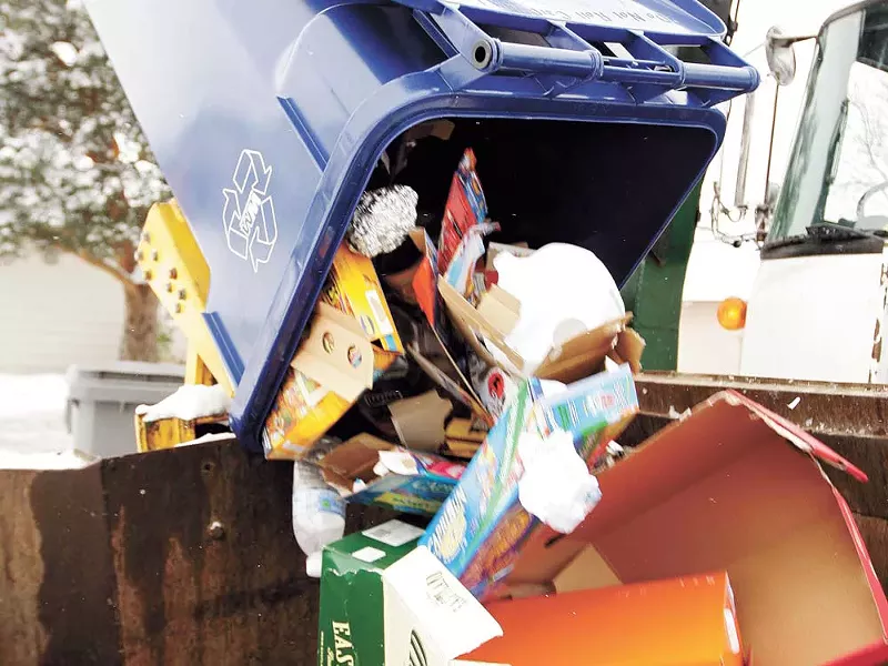 Waste Management, Coeur d'Alene's garbage collector, recently handed out nearly 16,000 blue 64-gallon wheeled carts for a new single-stream program - YOUNG KWAK