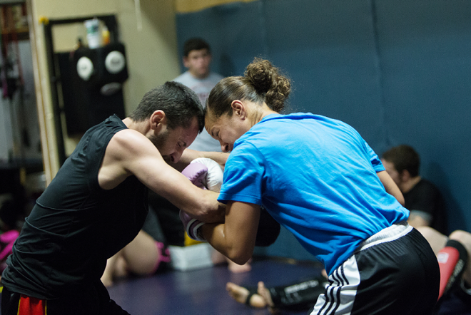 Elizabeth Phillips spars with Sik-Jitsu teammate Ron Nance during a recent training session. - YOUNG KWAK