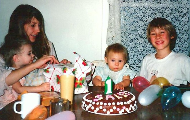 Years ago, Meier was renowned in her family for making elaborate homemade birthday cakes, like this one for Sally's first birthday - Two of her older kids, Jesse and Lisa, join the celebration - PROVIDED BY STEPHANIE RENEE MEIER'S FAMILY