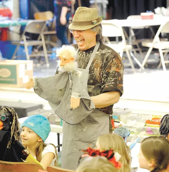 Dan Baginski instructs students on how to use their puppets