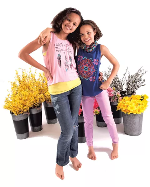 On Parrish: Vintage Havana Good Vibes tank, $35. Headbands of Hope elastic bow, $12. Yellow tank and jeans model's own. On Jazzy: Junk Food Clothing Peace & Love tank, $34. Mayoral violet leggings, $45. Headbands of Hope Fiesta buff, $15 at LIttle Citizen.
