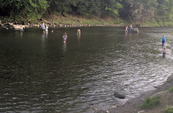 The Ottauquechee River behind White Cottage Snack Bar - BENJAMIN ROESCH