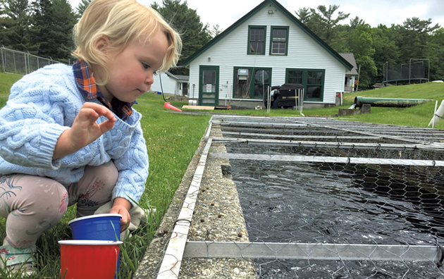 Joni feeding the fish - MEGAN JAMES