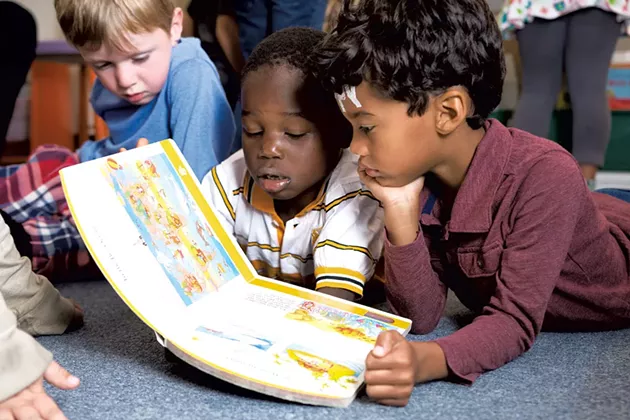 Kindergarten students at IAA reading together - SAM SIMON