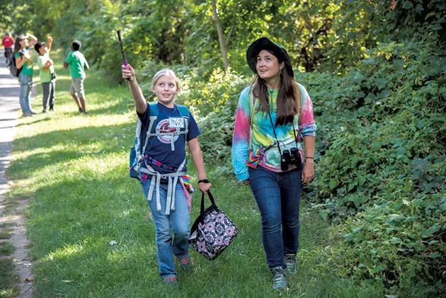 UVM senior Katlyn Williard and Flynn fifth grader Ivy spot a blue jay near the Burlington Bike Path - KEN PICARD