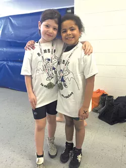 Ivy Resmer and Hinesburg wrestler Allyson Gutierrez celebrate first place wins in 2016 - CATHY RESMER