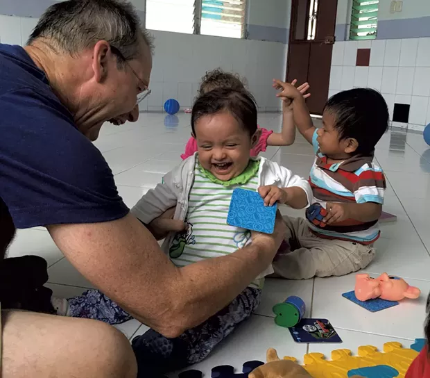 Dr. Donald Laub with an overseas patient - COURTESY OF DR. LAUB